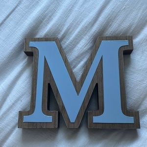 Blue letter M